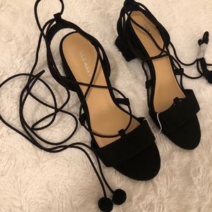 Black suede lace up heels w/ pom pom!
